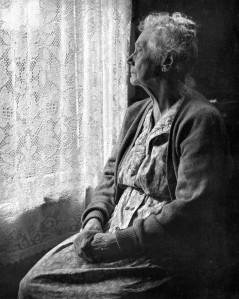 elderly-woman-sitting-looking-out-window-chalmers-butterfield